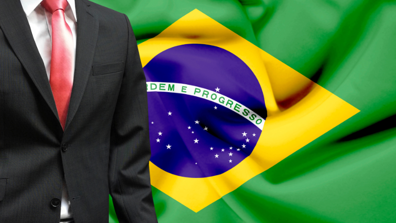 Bandeira do Brasil com um terno a frente.